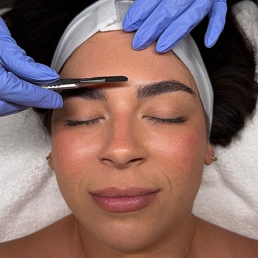 Beauty treatment with eyebrow shaping procedure.
