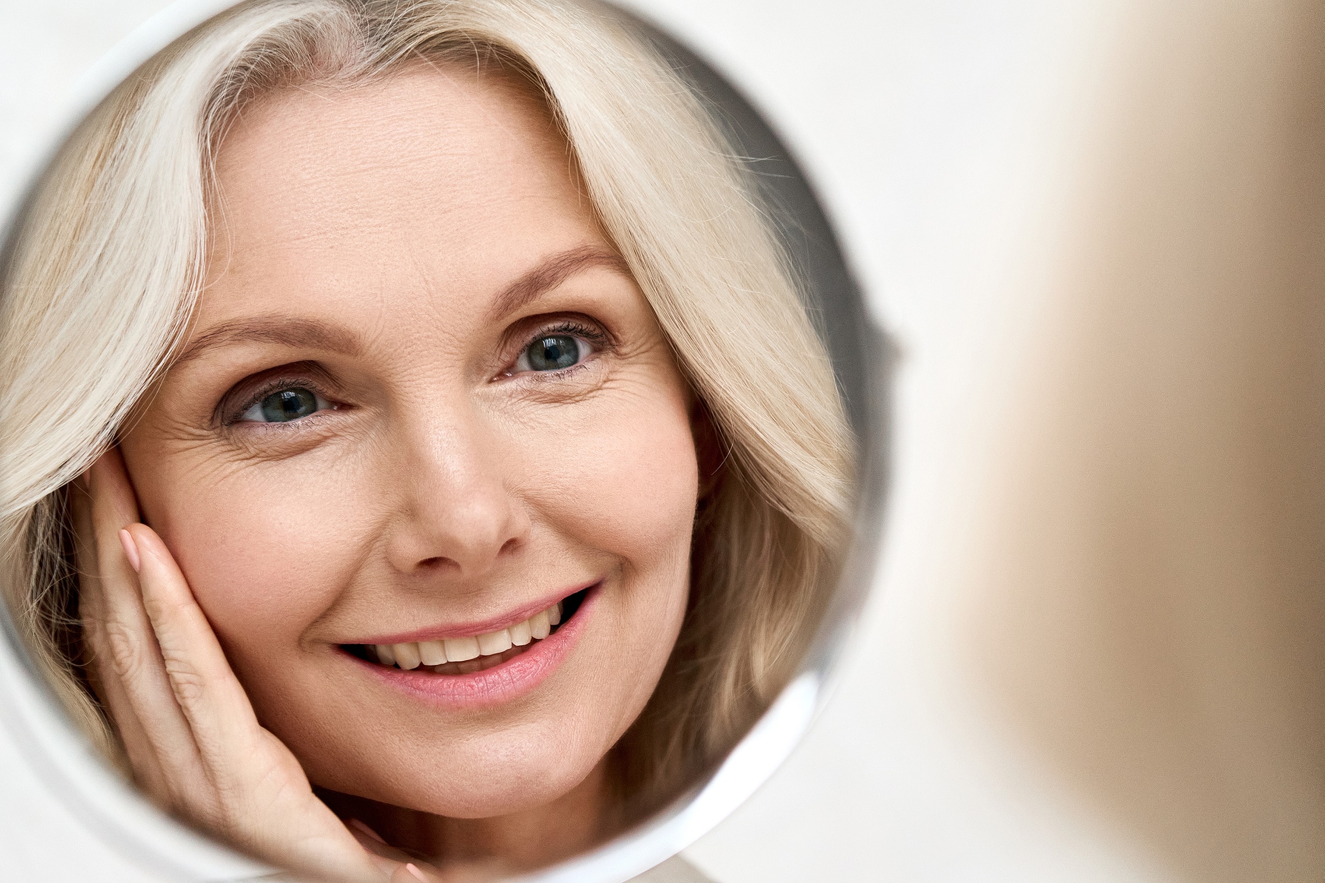 Woman in floral dress with a hat.