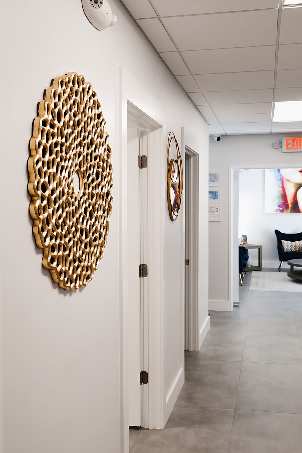 Decorative wall art in a modern hallway.
