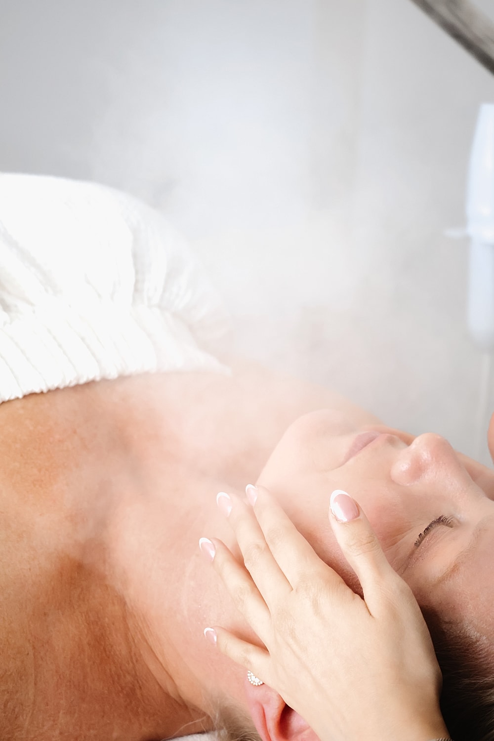 Facial treatment with steam and gentle massage.
